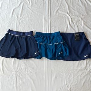 Nike size XS two skirts navy blue one skirt royal blue.